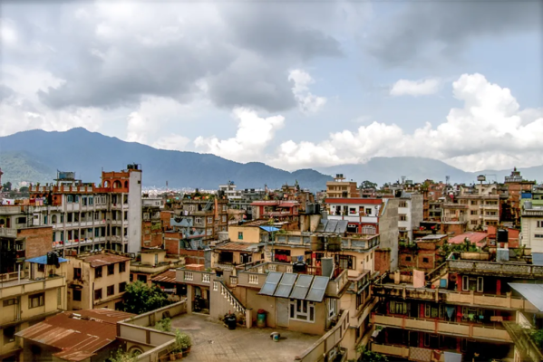 Rooftops of a city in Nepal in different shades of red and brown.
